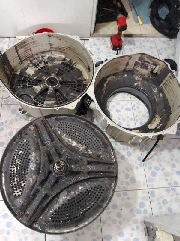vệ sinh khoang chứa máy giặt tại nhà